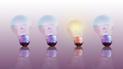 One glowing bulb which illustrates "standing out from the others"